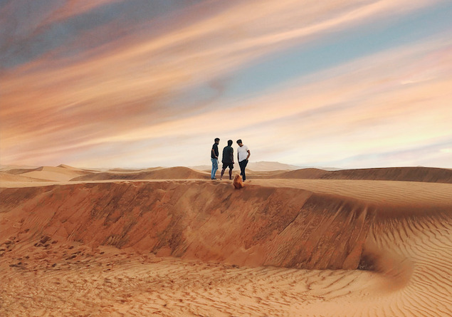 Men on sand dune Land of NEOM